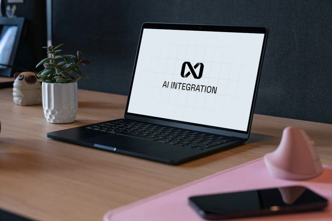 Laptop on a desk showing an AI integration screen, illustrating connecting Claude to an MCP video clipper